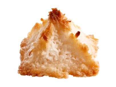 A coconut macaroon shaped like a pyramid against a white background