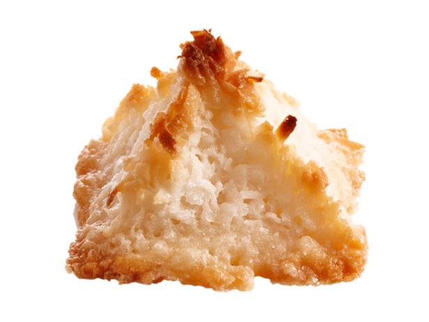 A coconut macaroon shaped like a pyramid against a white background
