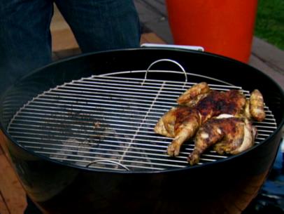 Grilled Butterfly Chicken atop a grill
