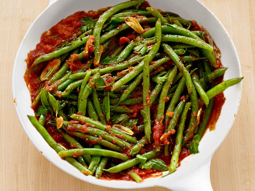 Green beans with pureed tomatoes in a white dish