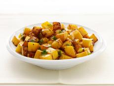 Diced roasted Rutabaga in a white bowl