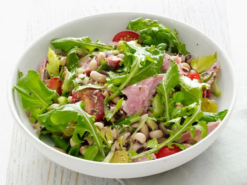 Smoked Turkey mixed with salad in a  white bowl