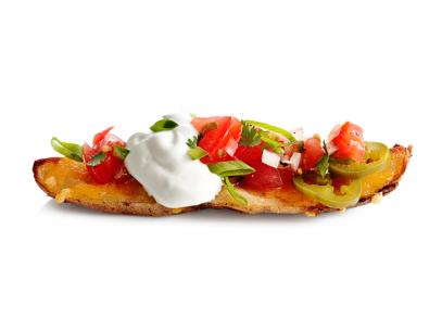 A loaded potato wedge against a white background