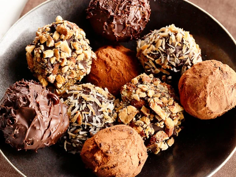 A variety of Doughnut Holes in a bowl