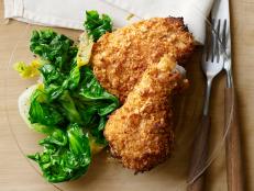 Savor Cat Cora's Crispy Baked "Fried" Chicken recipe from Food Network Magazine: Corn flakes make it crispy, while paprika, cayenne and sage give it spice.
