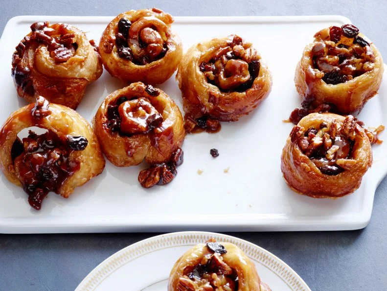 EASY STICKY BUNS, Ina Garten, Barefoot Contessa/Barefoot Classics, Food Network,Unsalted Butter, Light Brown Sugar, Pecans, Frozen Puff Pastry, Cinnamon, Raisins