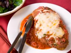 Classic chicken Parmesan comes breaded, fried and smothered in mozzarella cheese and then served alongside a plate of pasta. An order at some restaurants can tip the scales at 1,500 calories and 80 grams of fat per serving. Here's how to get the same flavor minus the extra fat.