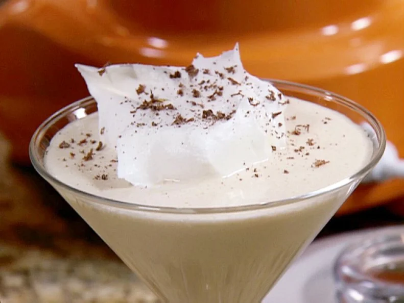 Gina's Grown-Up Milkshake - using a martini glass, vanilla ice cream, white chocolate liquer, and brandy. This glass has a dollup of whipped cream for the topping. 