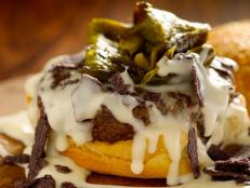 This is one seriously delicious cheeseburger inspired by the flavors of the Southwest, personal favorites of mine. A luscious, gooey queso sauce made with Monterey Jack cheese takes the place of sliced cheese and makes a secure bed for roasted and diced poblano chiles. Blue corn tortilla chips give the burger an unexpectedly perfect touch of salty crunch. The queso sauce would also be wonderful as a dip for chips or fries.