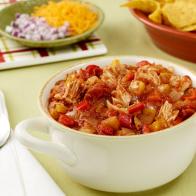 Chicken chili served in a white bowl.