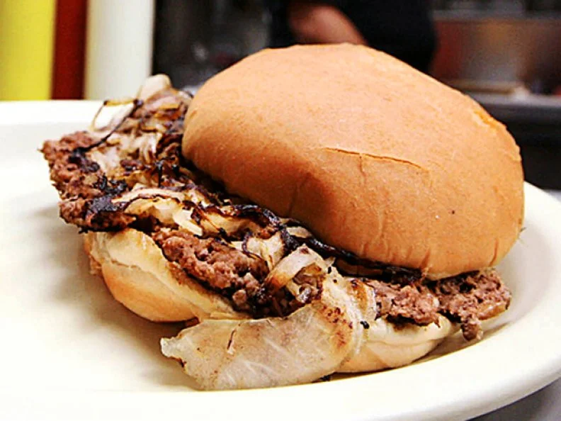 A ready-to-eat fried onion burger, prepared at Johnnie's Grill in El Reno, Okla., on September 23,2007, taken for the centennial food story. JAMES GIBBARD/Tulsa World