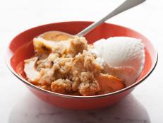 Ina Garten's Old-Fashioned Apple Crisp, a recipe from Barefoot Contessa on Food Network, is best served warm with a scoop of vanilla ice cream.