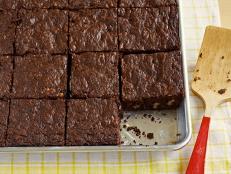With chopped walnuts and loads of chocolate, it's no wonder that Ina Garden's Outrageous Brownies recipe from Food Network comes with a five-star rating.