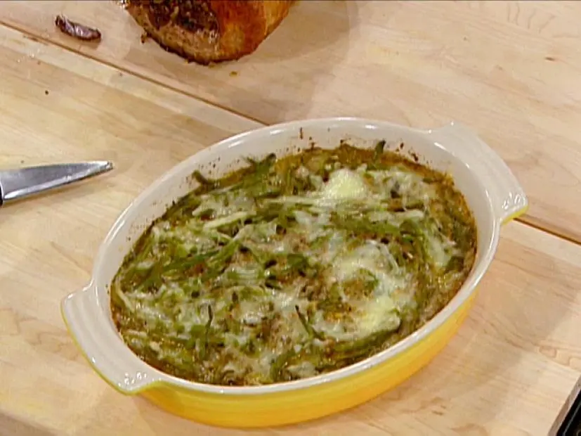 Green Bean Casserole in a Yellow and White Dish on a Butcher Block Counterop
