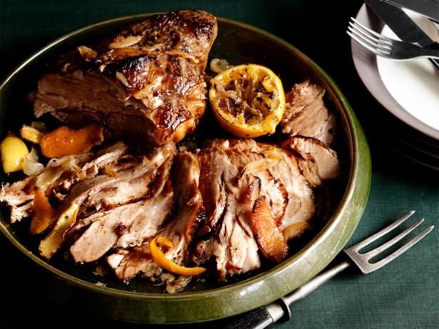 Cuban Slow Cooked Pork Shouler with Citrus Food in a Green Dish