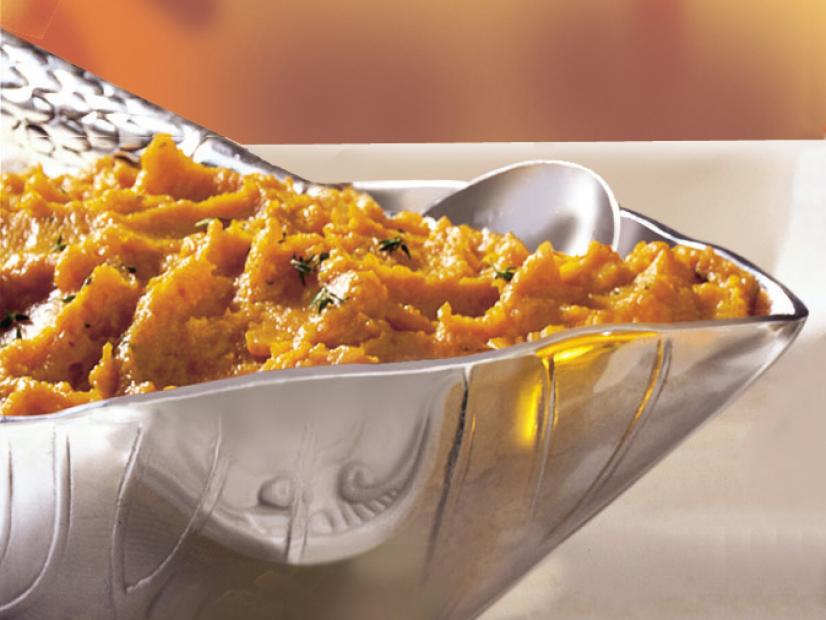 Mashed Sweet Potatos with Herb Garnish in a Silver Bowl