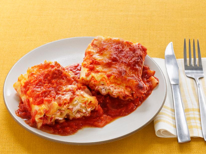 Plate of Lasagna Placed on a Yellow Table Cloth
