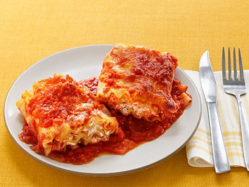 Plate of Lasagna Placed on a Yellow Table Cloth