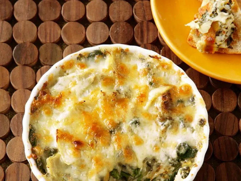 Spinach Artichoke Dip on a Wooden Place Setting