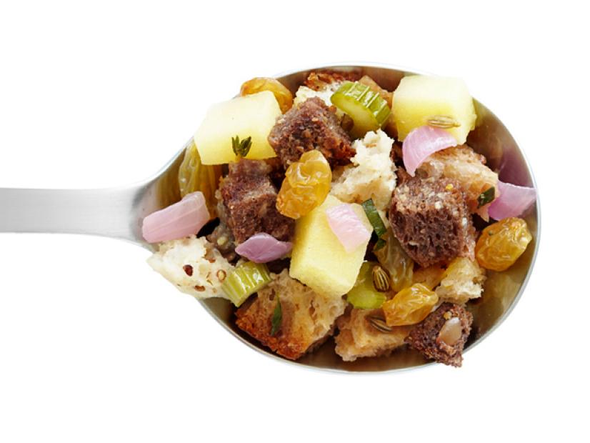 Stuffing Mixture Made of Apples, Raisins and Onions on a Spoon