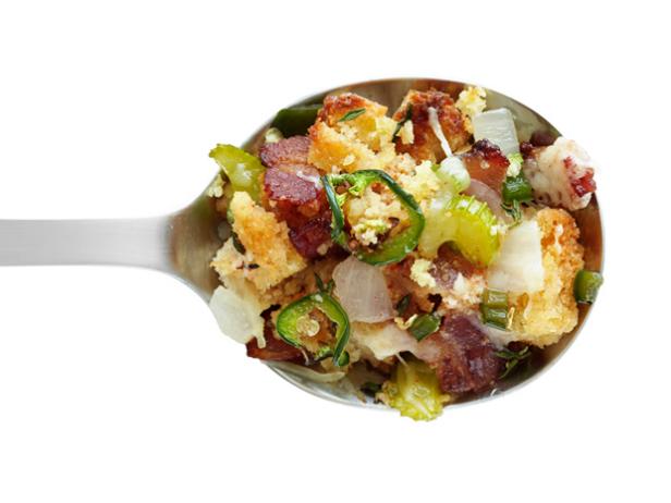 Stuffing Mixtute Made of Bacon, Vegetables and Bread on a Spoon