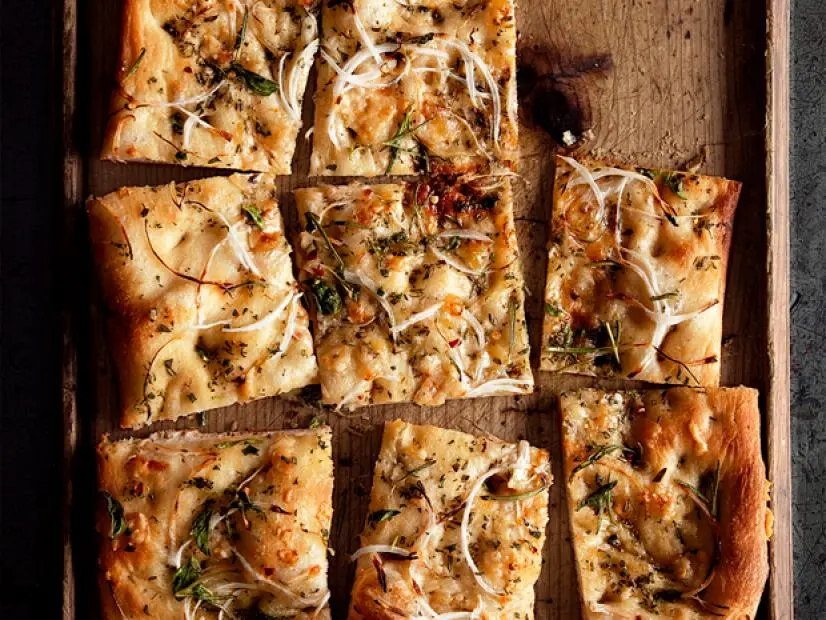 Foccaccia with Parmesan and Onions on a Wooden Tray