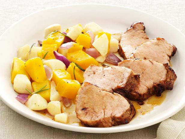 Pork Tenderloin Plated With a Mixture of Fruit and Onions