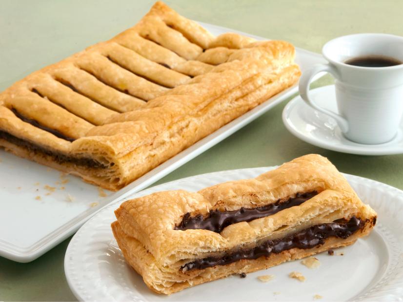 Chocolate Filled Pastries Grouped with a Cup of Coffee