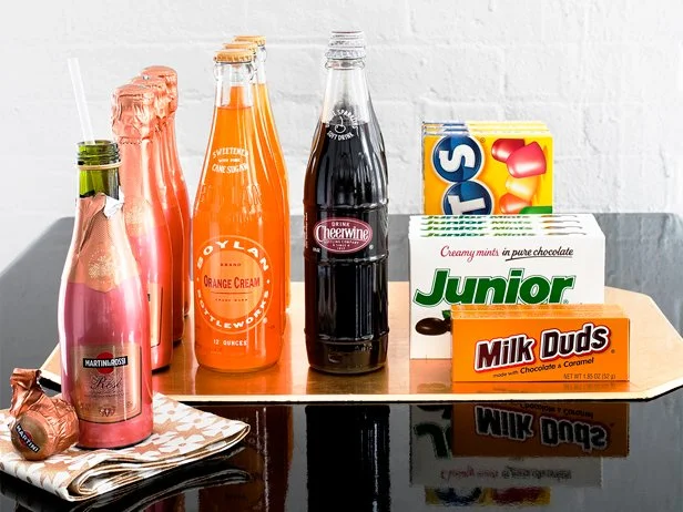 Theater candy and sodas on a gold place mat