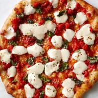 A pizza on a marble surface