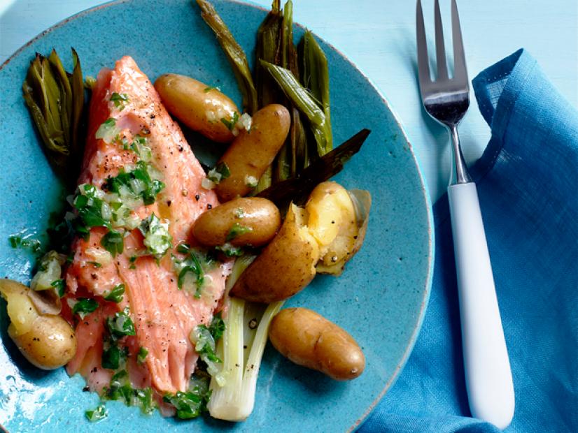 Roasted Salmon with vegetables on a blue plate