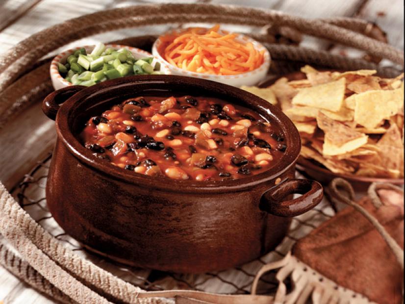 Baked Beans made of a variety of beans in a brown bowl