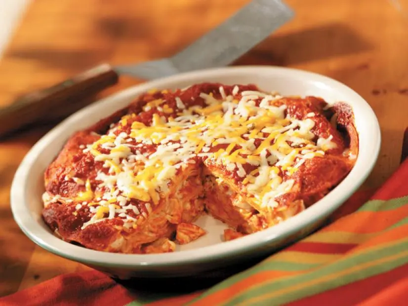 Chicken and Tortilla Enchilada Bake in a white dish