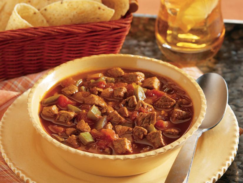 Texas Chili in a yellow bowl with small scalloped edges
