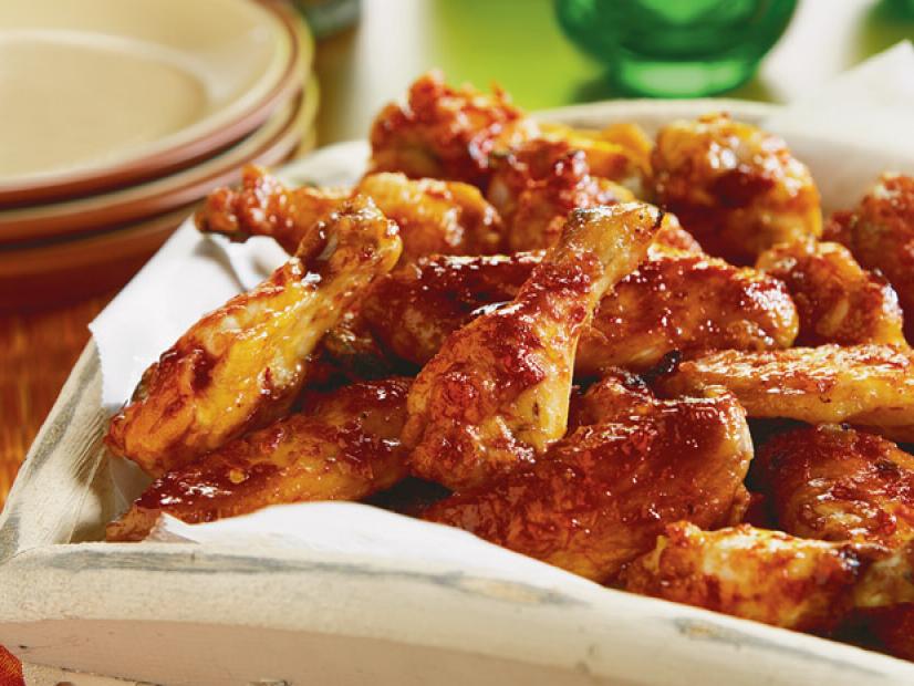 Sweet and Spicy Chicken Wings in a worn white dish