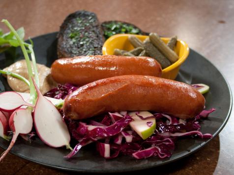 Braised Wurst Sausages with Cabbage, Red Onion and Apple Slaw
