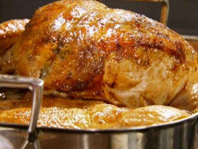 Roasted Thanksgiving turkey my way sets in a roasting pan.