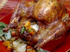 Crown your holiday feast with this Thanksgiving Pioneer-Style Herb Roasted Turkey recipe from Throwdown with Bobby Flay on Food Network.