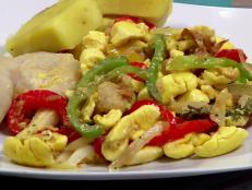 <p>It's all authentic and homemade at this Jamaican hole-in-the-wall. The silky ackee and salt-fish intrigued Guy, and he enjoyed the crunchy fried chicken with mango chutney sauce and munching on the coconut drops. Customers praise the curried goat and oxtail stew.</p>