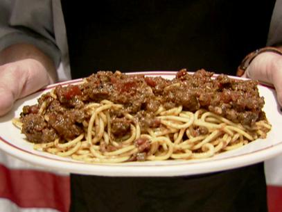 Alton brown makes his version of spaghetti and meat sauce. 