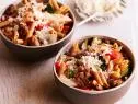 SAUSAGE AND ROASTED VEGETABLE PENNE Melissa d’Arabian Ten Dollar Dinners/Penne for Pennies Food Network Sweet Onion, Zucchini, Red Bell Pepper, Button Mushrooms, Olive Oil, Grape Tomatoes, Sweet or Hot Italian Sausage, White Wine, Whole Grain Penne Pasta, Parmesan