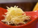 Mole Chili with cheese topping prepared by Rachael Ray. 