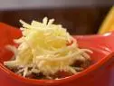 Mole Chili with cheese topping prepared by Rachael Ray. 