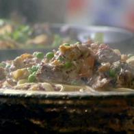 St. Patricks linguine with vegetables and corned beef is mixed with linguini and cheese.