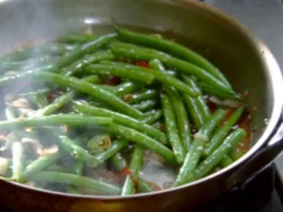 Sauteed green beans with soy, shallots, ginger, garlic, and chile.