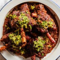 Description: Anne Burrell's Braised Lamb Shanks. Keywords: Orange, Lemon, Parsley, Garlic, Horseradish, Carrots, Celery, Lamb Shanks, Spanish Onion, Yellow Onions, Red Wine, Rosemary, Thyme, Gremolata.