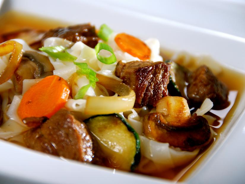 Chopped beef, vegetables and noodle mixture in a small square white dish