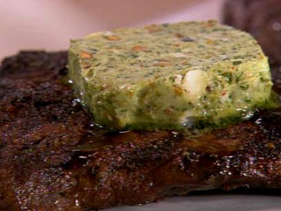 Close-up of a grilled Flat Iron Steak topped with herb butter
