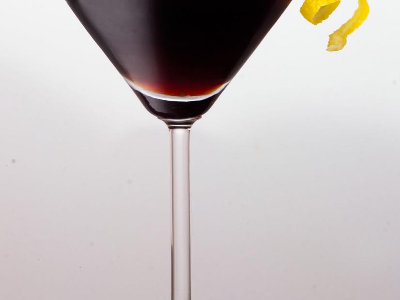 A Cuppa Joe Martini garnished with a spiral lemon wedge in a martini glass