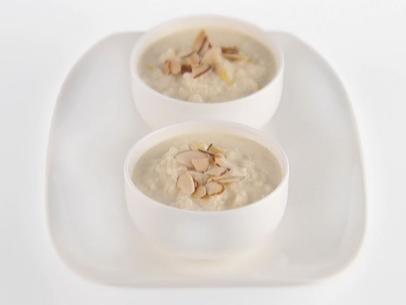 Lemon and almond rice pudding is topped with toasted almonds.